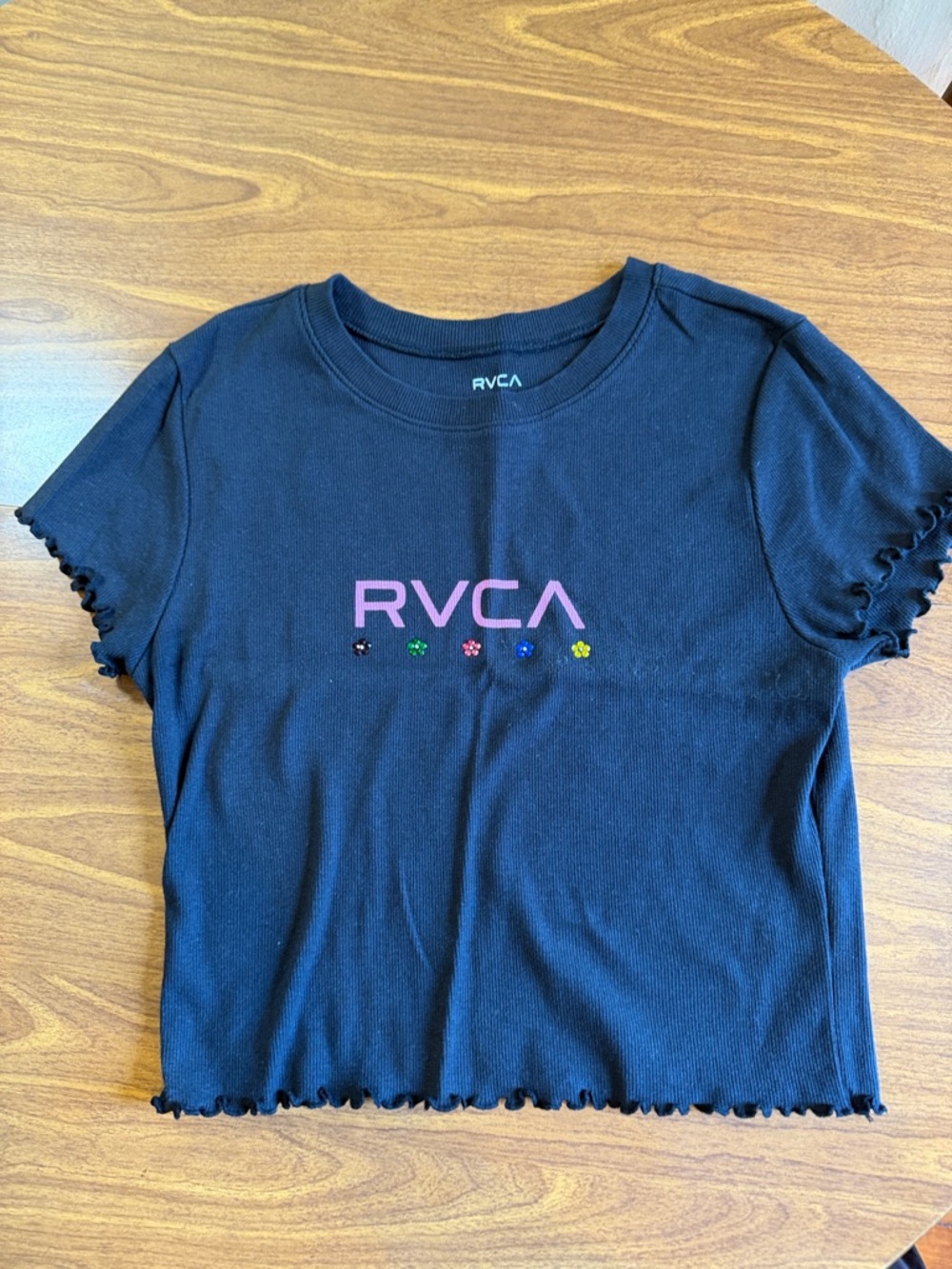 RVCA Black Crop Tee with Pink Logo and Multicolor Flower Accents